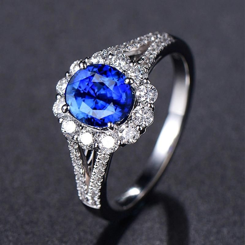 Four Claw Sapphire Blue Crystal with Diamond Ring