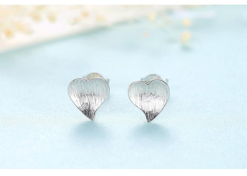 Silver Earrings Stud in Pressed Sand Shiny Surface